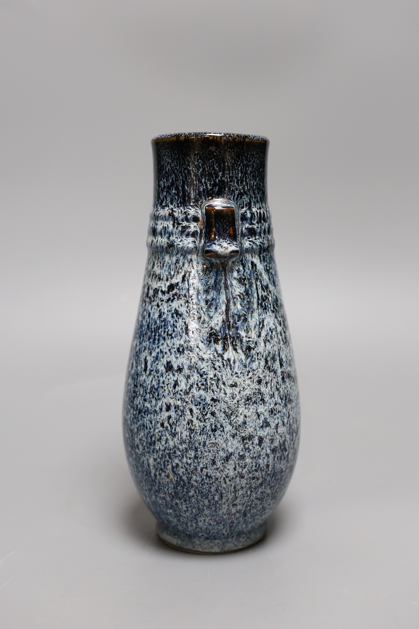 A Chinese Shiwan vase, 23 cms high